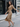 DressUp camel long sleeve wrap midi dress with side ring detail worn by a woman on a city street