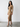 DressUp camel ribbed long sleeve midi wrap dress with side ring detail worn by a model with snakeskin heels